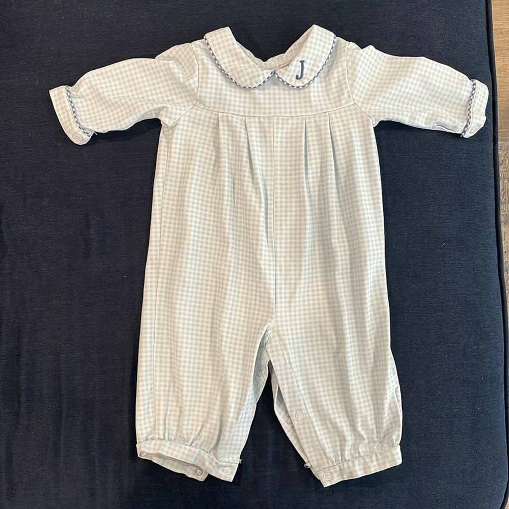 Blue and white long sleeve romper with navy piping and embroidery.